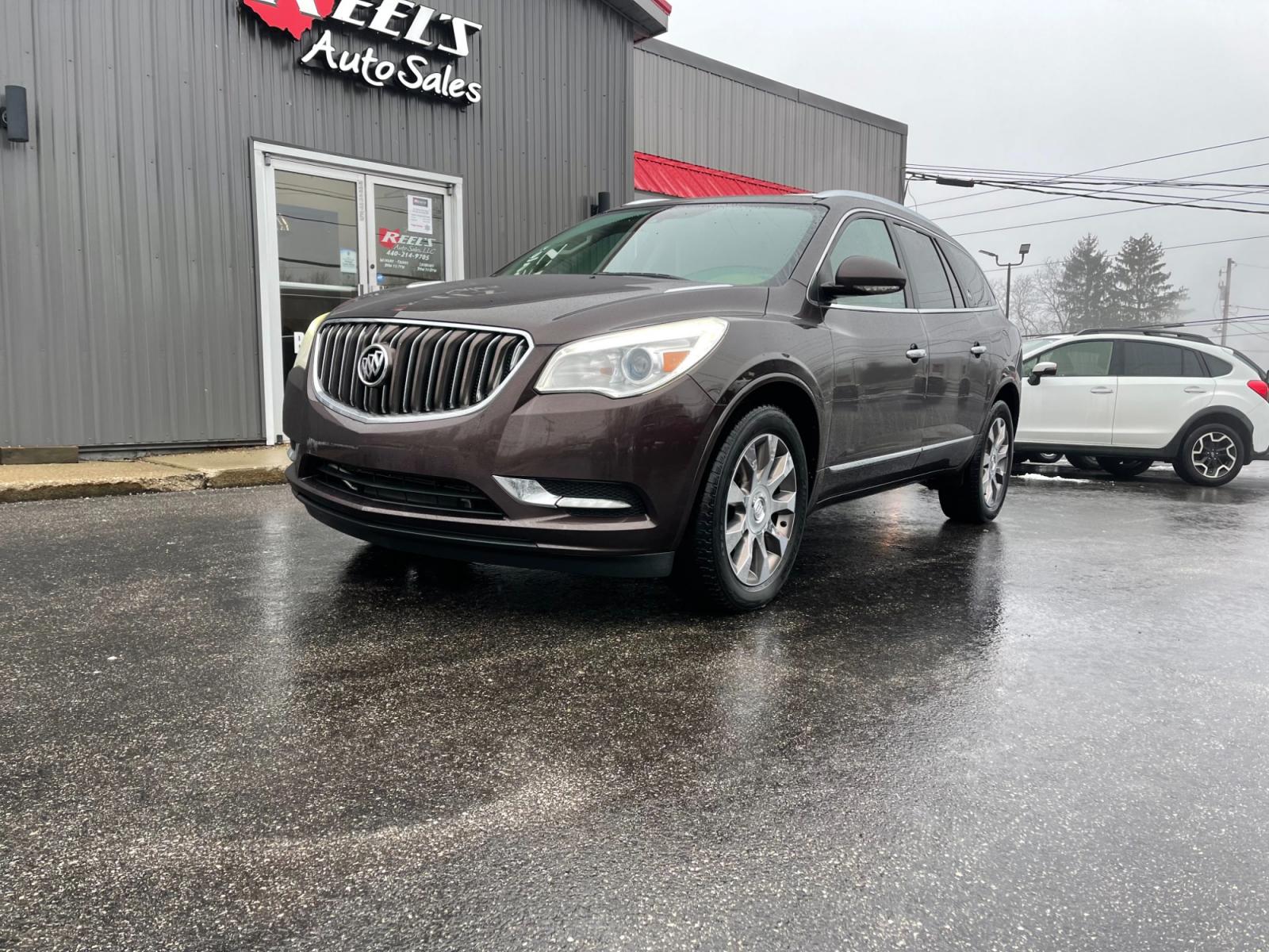2016 Brown /Brown Buick Enclave Premium AWD (5GAKVCKD4GJ) with an 3.6L V6 DOHC 24V engine, 6A transmission, located at 547 E. Main St., Orwell, OH, 44076, (440) 437-5893, 41.535435, -80.847855 - This 2016 Buick Enclave Premium AWD boasts a luxurious range of features including single-owner status, climate-controlled leather seats, adaptive HID headlights for improved visibility, and safety features like blind spot monitoring and rear cross-traffic alert. Its towing capability is notable at - Photo #0